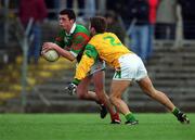 25 March 2000; Trevor Mortimer of Mayo in action against Paul Shankey of Meath during the Church & General National Football League Division 1B Round 6 match between Meath and Mayo at Páirc Tailteann in Navan, Meath. Photo by Ray Lohan/Sportsfile
