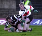 12 December 1999; Kieran O'Mahony of Doonbeg in action against Michael D Cahill of UCC during the AIB Munster Senior Club Football Championship Final match between UCC and Doonbeg at the Gaelic Grounds in Limerick. Photo by Brendan Moran/Sportsfile