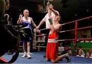 23 January 2015; Brendan Irvine, St. Paul's Boxing Club, Antrim, sinks to his knees after being delcared the winner over Hugh Myers, St. Brigids Boxing Club, Kildare, in their 49 kg bout. National Elite Boxing Championship Finals. National Stadium, Dublin. Picture credit: Cody Glenn / SPORTSFILE