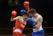 23 January 2015: Kurt Walker, Canal Boxing Club, Lisburn, left, exchanges punches with Séan Higginson, St.John Bosco Boxing Club, Belfast, during their 56kg bout. National Elite Boxing Championship Finals, National Stadium, Dublin. Picture credit: Ray Lohan / SPORTSFILE