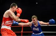 23 January 2015: Adam Nolan, Bray Boxing Club, exchanges punches with John Joe Joyce, St. Michael's Boxing Club, Athy, during their 69kg bout. National Elite Boxing Championship Finals, National Stadium, Dublin. Picture credit: Ray Lohan / SPORTSFILE