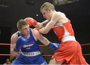 23 January 2015: Dean Walsh, St.Josephs/St.Ibars Boxing Club, Wexford, exchanges punches with Ray Moylette, St.Annes Boxing Club, Mayo, right, during their 64kg bout. National Elite Boxing Championship Finals, National Stadium, Dublin. Picture credit: Ray Lohan / SPORTSFILE