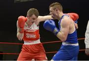 23 January 2015; Dean Walsh, left, St.Josephs/St.Ibars Boxing Club, Wexford, exchanges punches with Ray Moylette, St.Annes Boxing Club, Mayo, during their 64kg bout. National Elite Boxing Championship Finals, National Stadium, Dublin. Picture credit: Ray Lohan / SPORTSFILE