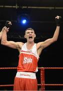 23 January 2015: Sean McComb, Holy Trinity Boxing Club, Belfast, celebrates victory over George Bates, St.Mary's Boxing Club, Dublin, after their 60Kg bout, National Elite Boxing Championship Finals, National Stadium, Dublin. Picture credit: Ray Lohan / SPORTSFILE