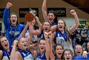 24 January 2015; Glanmire BC's Hollie Herlihy lifts the cup as her team-mates celebrate after the game. Basketball Ireland Women's U18 National Cup Final, DCU Mercy v Glanmire BC, National Basketball Arena, Tallaght, Dublin. Picture credit: Piaras O Midheach / SPORTSFILE