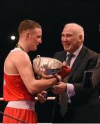 23 January 2015; Michael O'Reilly, Portlaoise Boxing Club, receives trophy, belt, and certificate after defeating Stephen Broadhurst, Dealgan Boxing Club, Dundalk, in their 75 kg bout. National Elite Boxing Championship Finals. National Stadium, Dublin. Picture credit: Cody Glenn / SPORTSFILE
