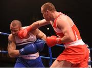 23 January 2015; Dean Gardiner, right, Clonmel Boxing Club, Tipperary,lands with a punch onto Constantin Popovicu, Johnstown Boxing Club, Meath, during their 91 kg+ bout. National Elite Boxing Championship Finals. National Stadium, Dublin. Picture credit: Cody Glenn / SPORTSFILE
