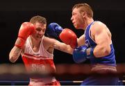 23 January 2015; Dean Walsh, left, St. Joseph's Boxing Club/St. Iban's Boxing Club, Wexford, exchanges punches with Ray Moylette, St. Anne's Boxing Club, Mayo, during their 64 kg bout. National Elite Boxing Championship Finals. National Stadium, Dublin. Picture credit: Cody Glenn / SPORTSFILE