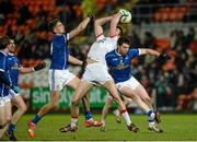 24 January 2015; Padraig McNulty, Tyrone, in action against Killian Clarke and Damien O'Reilly, Cavan. McKenna Cup Final, Tyrone v Cavan, Athletic Grounds, Armagh. Picture credit: Oliver McVeigh / SPORTSFILE