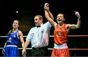 24 January 2015; Lauren Hogan, St Brigids, Co. Offaly, celebrates victory over Maeve Clarke, Ballinacarrow, Co. Sligo, during their 48 kg Light-flyweight bout. National Elite Boxing Championship Finals, National Stadium, Dublin. Picture credit: Pat Murphy / SPORTSFILE