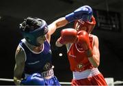 24 January 2015; Dervla Duffy, St Brigids, Kildare / Defence Forces, left, exchanges punches with Joanne Lambe, Carrickmacross, Monaghan, during their 57 kg Featherweight bout. National Elite Boxing Championship Finals, National Stadium, Dublin. Picture credit: Pat Murphy / SPORTSFILE