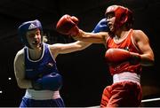 24 January 2015; Louise Donohue, Geesala, left, exhanges punches with Debbie O'Reilly, Olympic,  during their 60 kg bout. National Elite Boxing Championship Finals, National Stadium, Dublin. Picture credit: Piaras Ó Mídheach / SPORTSFILE