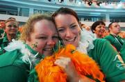2 October 2007; Team 2007 volunteers Aisling Clarke, left, from Clondalkin, Dublin, and Sarah Doyle, Wicklow, await the arrival of TEAM Ireland into the stadium during the opening ceremony of the 2007 Special Olympics World Summer Games, Shanghai Stadium, Shanghai, China. Picture credit: Ray McManus / SPORTSFILE
