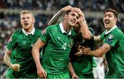 23 January 2015; Exhibition image from Sportsfile at the Professional Photographers Association of Ireland - Photographer of the Year Awards 2015. David Maher - Finalist in Sports Feature  14 October 2014; John O'Shea, Republic of Ireland, celebrates after scoring his side's equalizing goal with team-mates, from left, James McClean, Jeff Henderick and Stephen Ward. UEFA EURO 2016 Championship Qualifer, Group D, Germany v Republic of Ireland, Veltins Stadium, Gelsenkirchen, Germany. Picture credit: David Maher / SPORTSFILE