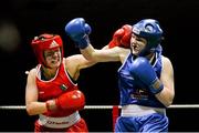24 January 2015; Christina Desmond, Macroom, Cork, left, exchanges punches with Claire Grace, Callan, Kilkenny, during their 69 kg bout. National Elite Boxing Championship Finals, National Stadium, Dublin. Picture credit: Piaras Ó Mídheach / SPORTSFILE