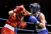 24 January 2015; Kelly Harrington, St Margarets, Dublin, right, exchanges punches with Kayleigh Murrihy, Kilfenora, Clare, during their 64 kg Light-welterweight bout. National Elite Boxing Championship Finals, National Stadium, Dublin. Picture credit: Pat Murphy / SPORTSFILE