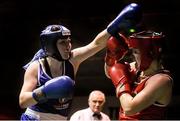 24 January 2015; Claire Grace, Callan, Kilkenny, left, exchanges punches with Christina Desmond, Macroom, Cork, during their 69 kg Welterweight bout. National Elite Boxing Championship Finals, National Stadium, Dublin. Picture credit: Pat Murphy / SPORTSFILE