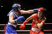 24 January 2015; Claire Grace, Callan, Kilkenny, left, exchanges punches with Christina Desmond, Macroom, Cork, during their 69 kg Welterweight bout. National Elite Boxing Championship Finals, National Stadium, Dublin. Picture credit: Pat Murphy / SPORTSFILE