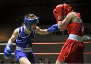 24 January 2015; Kelly Harrington, St Margarets, Dublin, left, exchanges punches with Kayleigh Murrihy, Kilfenora, Clare, during their 64 kg Light-welterweight bout. National Elite Boxing Championship Finals, National Stadium, Dublin. Picture credit: Pat Murphy / SPORTSFILE