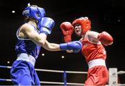 24 January 2015; Kelly Harrington, St Margarets, Dublin, left, exchanges punches with Kayleigh Murrihy, Kilfenora, Clare, during their 64 kg Light-welterweight bout. National Elite Boxing Championship Finals, National Stadium, Dublin. Picture credit: Pat Murphy / SPORTSFILE