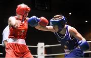 24 January 2015; Kelly Harrington, St Margarets, Dublin, right, exchanges punches with Kayleigh Murrihy, Kilfenora, Clare, during their 64 kg Light-welterweight bout. National Elite Boxing Championship Finals, National Stadium, Dublin. Picture credit: Pat Murphy / SPORTSFILE