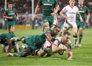 24 January 2015; Darren Cave, Ulster, goes over to score his hat-trick try, despite the tackle of Vereniki Goneva, Leicester Tigers. European Rugby Champions Cup 2014/15, Pool 3, Round 6, Ulster v Leicester Tigers, Kingspan Stadium, Ravenhill Park, Belfast, Co. Antrim. Picture credit: John Dickson / SPORTSFILE