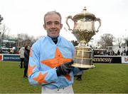 25 January 2015; Jockey Ruby Walsh holds up the Arkle Perpetual trophy after he rode Un De Sceaux to win The Frank Ward Solicitors Arkle Novice Steeplechase. Leopardstown, Co. Dublin. Picture credit: Barry Cregg / SPORTSFILE