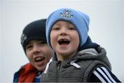 25 January 2015; Dublin supporter Aaron Murphy, aged 6, from Tallaght, right, and Ross Sweeney, aged 7, from Glenties in Donegal and a Kildare supporter, enjoying the game. Bord na Mona O'Byrne Cup Final, Kildare v Dublin, St Conleth's Park, Newbridge, Co. Kildare. Picture credit: Piaras Ó Mídheach / SPORTSFILE
