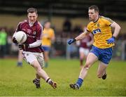 25 January 2015; Danny Cummins, Galway, in action against Niall Carty, Roscommon. FBD Connacht League Final, Roscommon v Galway, Kiltoom, Co. Roscommon. Picture credit: David Maher / SPORTSFILE