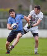 25 January 2015; Michael Darragh Mcauley, Dublin, is tackled by Kildare's Fionn Dowling. Bord na Mona O'Byrne Cup Final, Kildare v Dublin, St Conleth's Park, Newbridge, Co. Kildare. Picture credit: Ray McManus / SPORTSFILE