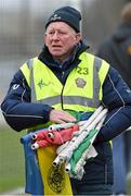 25 January 2015; Pat Lynch collects the flags after the game.  Bord na Mona O'Byrne Cup Final, Kildare v Dublin, St Conleth's Park, Newbridge, Co. Kildare. Picture credit: Ray McManus / SPORTSFILE