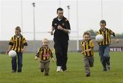 10 October 2007; Current All-Ireland Club Champions Crossmaglen Rangers were recognised for their contribution to Club Football at the official launch of the 2007/8 AIB Club Championships. Crossmaglen have claimed four AIB All-Ireland Club Titles in the last ten years. Photographed at the club grounds is 2007 winning captain Oisin McConville with nephews, from left, Rian, age 10, Aaron, age 2, Dara, age 3, and Oisin age 11. Crossmaglen Rangers Oliver Plunkett Park, Co. Armagh. Picture credit: Brian Lawless / SPORTSFILE