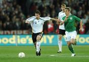 13 October 2007; Arne Friedrich, Germany, in action against Kevin Doyle, Republic of Ireland. 2008 European Championship Qualifier, Republic of Ireland v Germany, Croke Park, Dublin. Picture credit; Paul Mohan / SPORTSFILE
