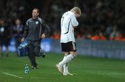 13 October 2007; Germany's Bastian Schweinsteiger leaves the field with his head in his hands after picking up an injury. 2008 European Championship Qualifier, Republic of Ireland v Germany, Croke Park, Dublin. Picture credit; Brian Lawless / SPORTSFILE