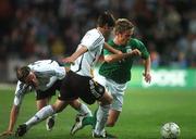 13 October 2007; Kevin Doyle, Republic of Ireland, in action against Arne Friedrich and Clemens Fritz, left, Germany. 2008 European Championship Qualifier, Republic of Ireland v Germany, Croke Park, Dublin. Picture credit; Pat Murphy / SPORTSFILE