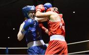 24 January 2015; Louise Donohue, Geesala, Mayo, left, exchanges punches with Debbie O'Reilly, Olympic, Galway, during their 60 kg bout. National Elite Boxing Championship Finals, National Stadium, Dublin. Picture credit: Piaras Ó Mídheach / SPORTSFILE