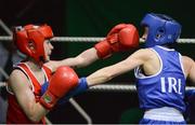 24 January 2015; Lauren Hogan, St Brigids Edenderry, left, exchanges punches with Maeve Clarke, Ballinacarrow, during their 48 kg bout. National Elite Boxing Championship Finals, National Stadium, Dublin. Picture credit: Piaras Ó Mídheach / SPORTSFILE