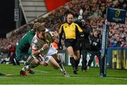 24 January 2015; Craig Gilroy, Ulster, dives over to score his side's fourth try of the game despite the tackle of Matthew Tait, Leicester Tigers. European Rugby Champions Cup 2014/15, Pool 3, Round 6, Ulster v Leicester Tigers, Kingspan Stadium, Ravenhill Park, Belfast, Co. Antrim. Picture credit: Ramsey Cardy / SPORTSFILE