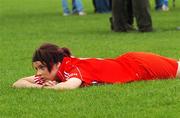 14 October 2007; Aisling Thompson, Cork, lies dejected after the match. All-Ireland Minor A Camogie Championship Final, Kilkenny v Cork, Clonmel Commercial Park, Clonmel, Co. Tipperary. Picture credit: Stephen McCarthy / SPORTSFILE