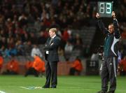 17 October 2007; Republic of Ireland manager Steve Staunton watches on as 4th official Jouni Hyytia announces 3 minutes of injury time at the end of the second half. 2008 European Championship Qualifier, Republic of Ireland v Cyprus, Croke Park, Dublin. Picture credit; Brian Lawless / SPORTSFILE