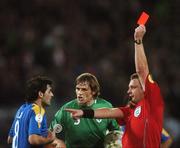 17 October 2007; Marios Ilia, Cyprus, is shown the red card by referee Mikko Vuorela, who is refereeing his last ever game, as Republic of Ireland's Kevin Kilbane looks on. 2008 European Championship Qualifier, Republic of Ireland v Cyprus, Croke Park, Dublin. Picture credit; Pat Murphy / SPORTSFILE