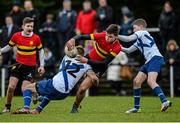 27 January 2015; Max Read, CBC Monkstown, is tackled by Stephen Kane, left, and Aaron O'Neill, St. Andrew's College. Bank of Ireland Leinster Schools Fr. Godfrey Cup, Semi-Final, CBC Monkstown v St. Andrew's College, Anglesea Road, Dublin. Picture credit: Piaras Ó Mídheach / SPORTSFILE