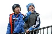 25 January 2015; Dublin supporter Aaron Murphy, aged 6, from Tallaght, right, and Ross Sweeney, aged 7, from Glenties in Donegal and a Kildare supporter, enjoying the game. Bord na Mona O'Byrne Cup Final, Kildare v Dublin, St Conleth's Park, Newbridge, Co. Kildare. Picture credit: Piaras Ó Mídheach / SPORTSFILE