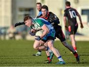 28 January 2015; Kieran Martin, Athlone IT, in action against Gary O'Donoghue, Trinity College. Independent.ie Sigerson Cup, Preliminary Round, Trinity College v Athlone IT. Clanna Gael GAC, Ringsend, Dublin. Picture credit: Barry Cregg / SPORTSFILE