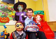 18 October 2007; Soccer legend and former Irish International player Denis Irwin, with from left, 10 year old, Liam Gannon, 6 year old, Jordon Hazzard and 2 year old, Jodie Flynn, on a visit to Temple Street Children's University Hospital, to launch the 'Trick or Treat' campaign. 'Trick or Treat' will run from the 24th October to the 31st October 2007, with key rings being sold at Tesco stores, shopping centres, on-street locations and workplaces nationwide. You can also support Temple Street by texting Treat to 57502, each text costs 2euro. Temple Street, Dublin. Picture credit: Matt Browne / SPORTSFILE