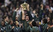 20 October 2007; South Africa's Bismarck Du Plessis holds the trophy as his team celebrate. Rugby World Cup Final, South Africa v England,Stade de France, Paris. Picture credit; Paul Thomas / SPORTSFILE