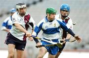 26 October 2007; Eddie Holland, Defence Forces, in action against Colin Herity, left, and Mark Hennessy, AIB Group. 25th Anniversary Annual Representative Hurling Game, AIB Group v Defence Forces, Croke Park, Dublin. Picture credit: Pat Murphy / SPORTSFILE
