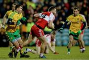 31 January 2015; Emmett McGuckin, Derry, in action against Eamonn McGee, Donegal. Allianz Football League Division 1, Round 1, Donegal v Derry. MacCumhail Park, Ballybofey, Co. Donegal Picture credit: Oliver McVeigh / SPORTSFILE