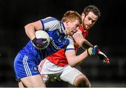 31 January 2015: Kieran Hughes, Monaghan, in action against Ronan McNamee, Tyrone. Allianz Football League Division 1, Round 1, Tyrone v Monaghan. Healy Park, Omagh, Co. Tyrone Photo by Sportsfile
