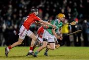 31 January 2015: Adrian Breen, Limerick, in action against Brian O'Sullivan, left, and William Kearney, Cork. Waterford Crystal Cup Final, Cork v Limerick. Mallow GAA Grounds, Mallow, Co. Cork Picture credit: Ramsey Cardy / SPORTSFILE